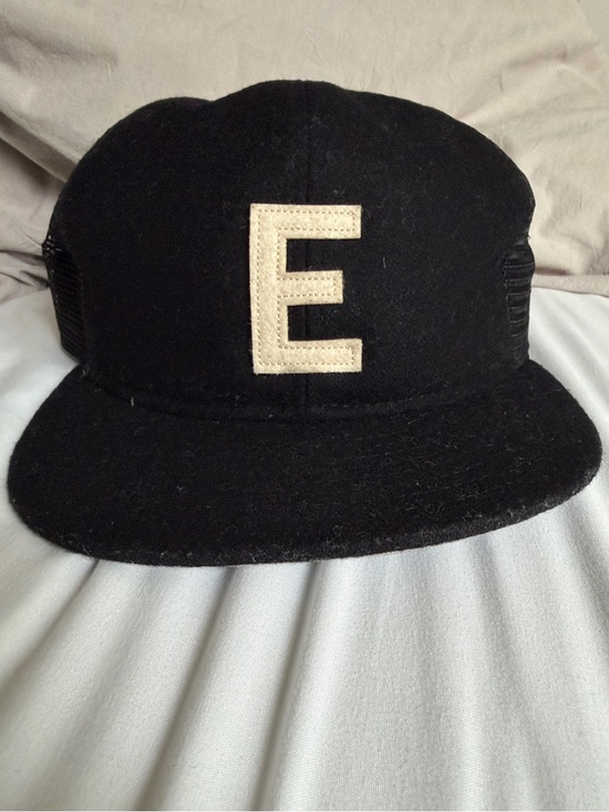 Fear of God Other - Fear of God Black Trucker Hat with Cream 'E' Patch
